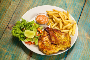Grilled chicken fillet with french fried potato