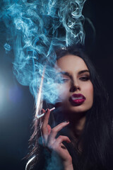 Sexy girl smoking cigarette. Elegant woman with smoke. Sexy model Smoking cigarette. Sensual Woman red lips. Beautiful woman blowing smoke. Stylish girl with cigarette. Sexy model with cigarette.
