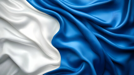 Obraz premium A close-up of flowing silk fabric in white and blue, symbolizing elegance and pride.