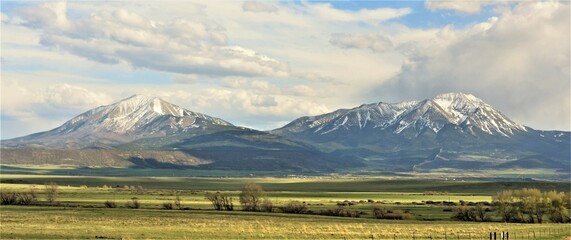 The Spanish Peaks are a pair of prominent mountains located in southwestern Huerfano County, Colorado. The Spanish Peaks were designated a National Natural Landmark in 1976.