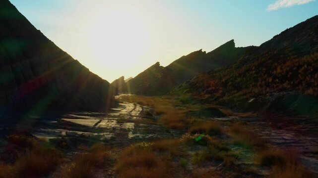 Drone footage of a dried hills landscape and morning sunlight in Hingol Balochistan National Park