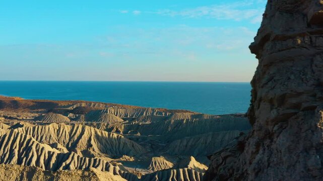 Aerial view of  desert with unique rock formations and a sea in Hingol Balochistan National Park