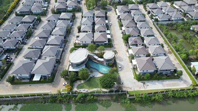 Drone footage of Chao Phraya River in Pathum Thani, Thailand with a view of the surrounding suburbs