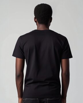 Mockup: Back View of Person Wearing Plain Black T-Shirt Against Light Background