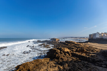 Atlantic ocean view with big waves and cliffs from Essaouira town Morocco
