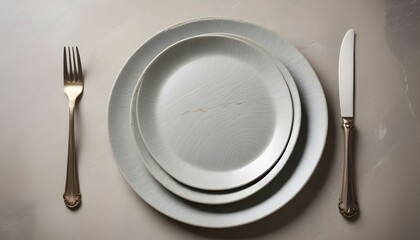 Table setting. plate, knife and fork on stone background