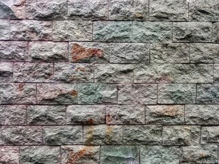 Stone background on the wall. Natural texture. abstract pattern of arranged stones 