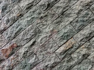 Stone background on the wall. Natural texture. abstract pattern of arranged stones 