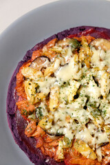 Close-up of homemade purple sweet potato pizza.
