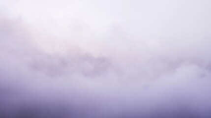 Obraz premium Soft lavender and gray mist envelops the landscape during a serene morning moment