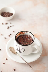 Chocolate cupcake in a white mug. Easy homemade dessert. Mugcake