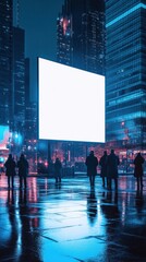 Nighttime gathering in an urban space with a large blank screen and city lights reflecting on wet pavement
