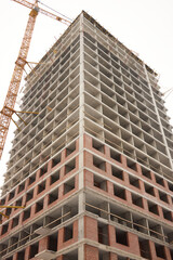Obraz premium A bustling Construction Site showcasing Cranes, Building Framework, and full activity all around