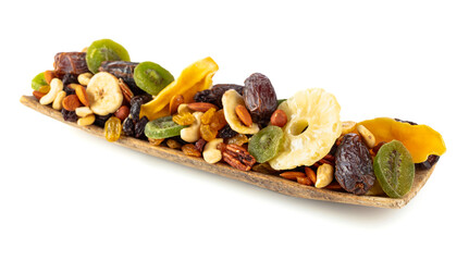 Dried tropical fruits, nuts, and raisins isolated on white.
