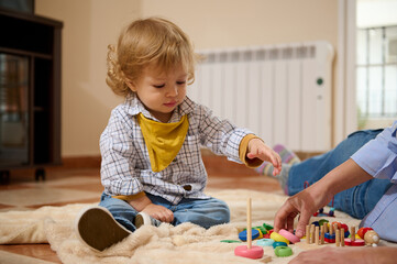 Playful Toddler Engaged in Colorful Educational Activities Indoors