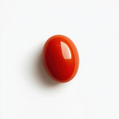 Single glossy red cherry tomato resting on a clean white background showcasing its vibrant color and freshness