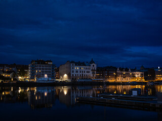 Fototapeta premium Night photography of Harnosand, Vasternorrland province, Sweden. Important port city on the Bothnian Sea.
