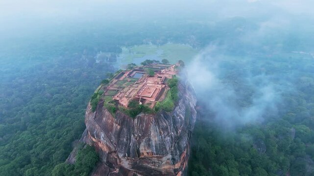 view of the famous ancient stone fortress Sigiriya (Lion Rock) on the island of Sri Lanka, which is a UNESCO World Heritage Site.