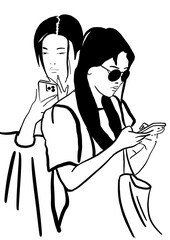 Two young women with mobile phones. 