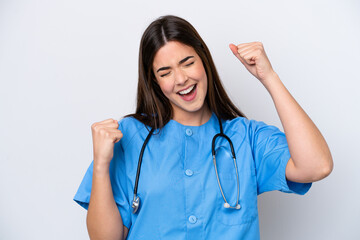 Young Brazilian nurse woman isolated on white background celebrating a victory