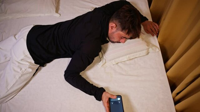 Drowsy person gropes but picks up the buzzing phone