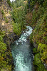 Elk falls in British Columbia, Vancouver Island, Canada, features a large waterfall cascading into a rock valley.
