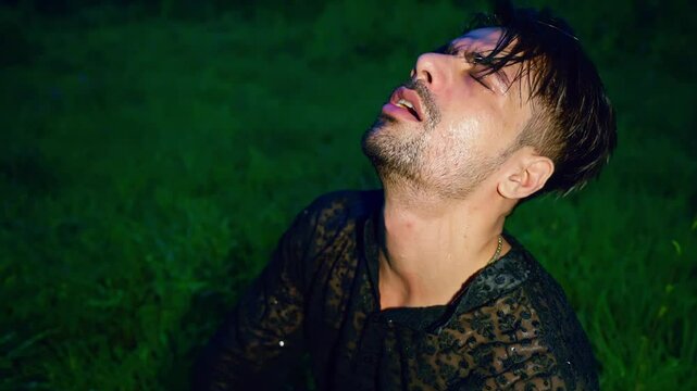 Man wet in rain tears falling with his emotion at jungle
