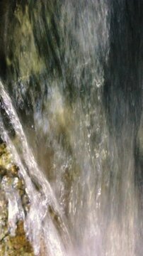 A dense stream of stream water pouring onto the rocks