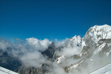 snowy landscapes photographed from punta helbronner, on the skyway of the mont blanc mountain range on a summer day in july