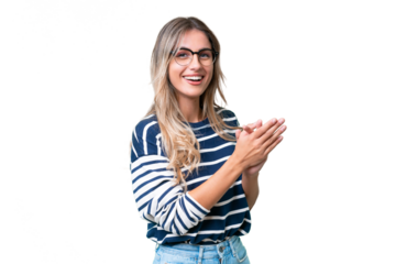 Young Uruguayan woman over isolated background applauding