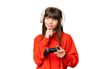Little caucasian girl playing with a video game controller over isolated background and looking up
