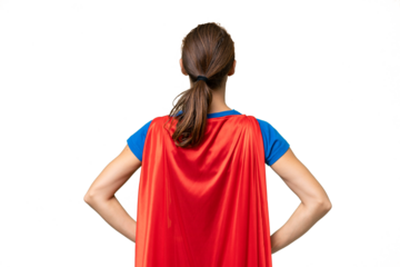 Young caucasian woman over isolated background in superhero costume in back position