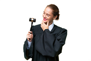 Judge caucasian woman over isolated background looking to the side and smiling
