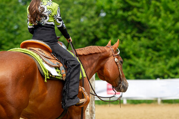Junior rider competing in a western show