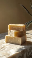 Natural handmade soap stacked on a marble countertop with soft lighting in a serene indoor setting
