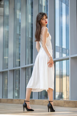 Fototapeta premium Full body portrait of a young beautiful brunette woman