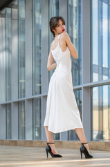 Full body portrait of a young beautiful brunette woman