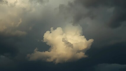 Obraz premium Dark stormy sky with a few white and beige clouds in the background, white, beige, weather
