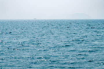 tranquil seascape with the horizon and fog