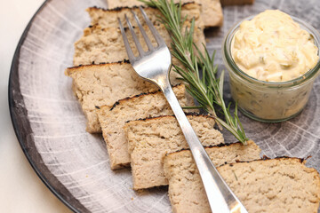 Slices of rabbit pâté with tartar sauce in a glass jar. Elegant finger food for banquets. Gourmet buffet catering selection. Decorative plate for fine dining eating.