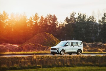 Fototapeta premium Energy-efficient car driving through nature