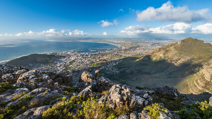 Incredible view of Cape town with lions head from above at Table Mountain national park with rocks and blue sky, Cape Town, Western Cape, South Africa, Africa