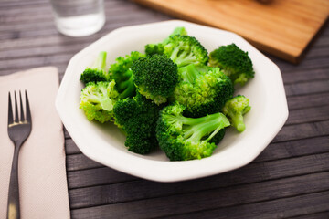 Boiled broccoli inflorescences in plate