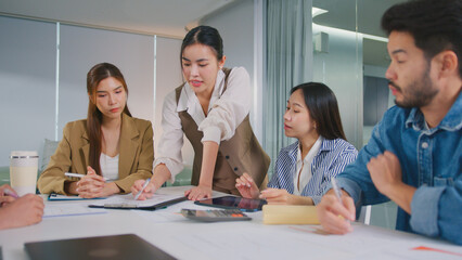 Confident Women leader discussing strategy meeting teamwork collaboration business growth analysis financial data presenting reports managing startup success corporate office people partnership