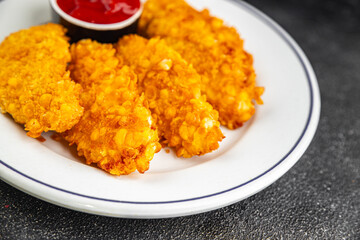 Nuggets chicken meat breaded deep fried fresh tasty food dish gourmet food background on the table rustic food top view copy space
