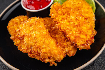 Nuggets chicken meat breaded deep fried fresh tasty food dish gourmet food background on the table rustic food top view copy space