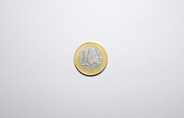A one-euro coin on a white background.