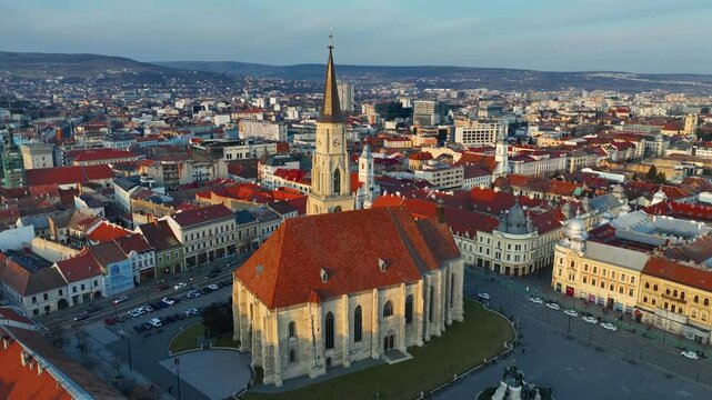 drone shot of Cluj Napoca, Saint Michaels church in central square in Romanian town of Cluj Napoca, travel in Transilvania, Romania 