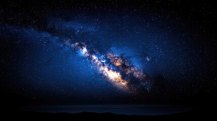 Fototapeta premium Stunning view of the Milky Way galaxy illuminating the night sky over a serene landscape