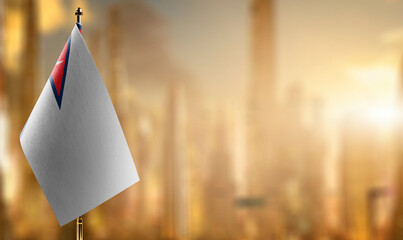 Small flags of the Nepal on an abstract blurry background